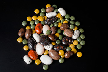 .Pebble-dragee with apricots, chocolate, mandarin and marzipan.