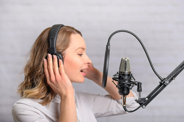 Speech recording on radio stations, the announcer works in the studio with a studio microphone