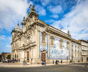 Fototapeta na wymiar Side view of famous twin churches - Carmelite Church and Carmo Church in Porto 