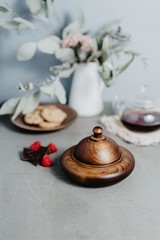 Table with wooden utensils, raspberries