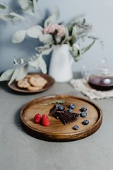 Slices of chocolate, blueberries and raspberries