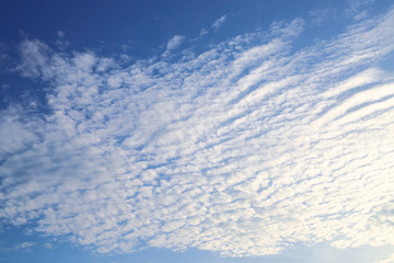 Naklejka na ściany i meble sunlight shiny through white cloud on blue sky background