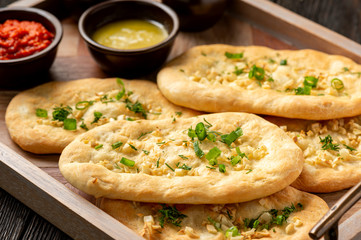 Homemade naan bread with garlic and butter.