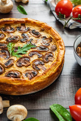 Jellied pie with meat and mushrooms on potato dough
