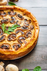 Jellied pie with meat and mushrooms on potato dough