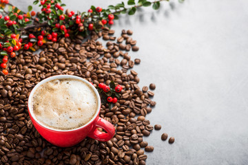 Cappuccino or latte with milk foam in a red cup