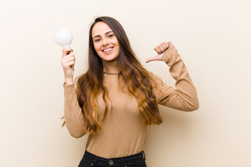 young pretty woman with  bulb, having an idea