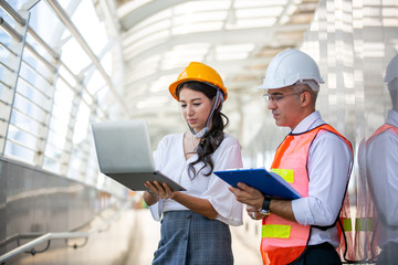 The engineer and business people hand high five against building. The concept of engineering,...