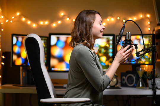 A Blogger Is Recording A Podcast With A Microphone And Computers In The Background. Blogging And Podcasts, Recording On YouTube