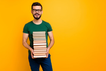 Portrait of positive guy high school student hold pile stack paper book ready learn prepare exam...