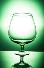 glass of water on green background