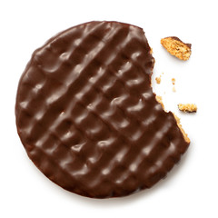 Dark chocolate coated digestive biscuit isolated on white. Partially eaten with crumbs. Top view.
