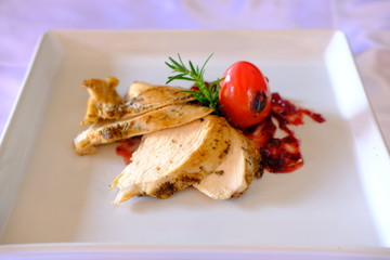 Grilled chicken steak on table