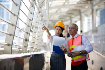 The engineer and business people hand high five against building. The concept of engineering,...