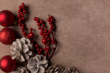 Christmas bauble with pine cones on a soft background