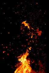 Fototapeta na wymiar Flame, sparks on a black background.