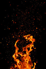 Fototapeta na wymiar Flame, sparks on a black background. Bokeh effect.