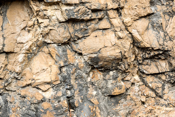 Texture of natural layered limestone surface rock, quarry limestone, limestone hill