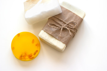 Three pieces of soap on a white background close-up. Design concept for natural cosmetics or spa. View from above.