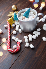 Christmas marshmallows and new year decorations on wood background. Winter holidays, New Year mood