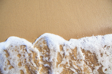 Bright sandy beach coastline.