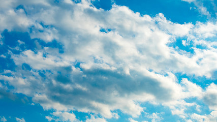 Blue sky with puffy white clouds