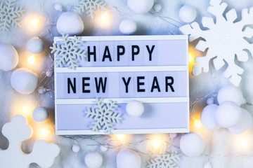 Happy New Year background. Creative layout made of greeting letters  with winter decoration. Flat...