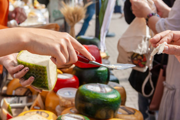 Cheese tasting at the traditional cheese market