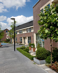 Fototapeta na wymiar Biddinghuizen. Modern Dutch architecture. Houses. Residential housing. Netherlands. Flevopolder