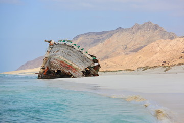 Fototapeta na wymiar Abandoned ship wreck on the beach of Socotra island