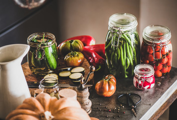 Autumn vegetable pickling and canning. Ingredients for cooking and glass jars with homemade...