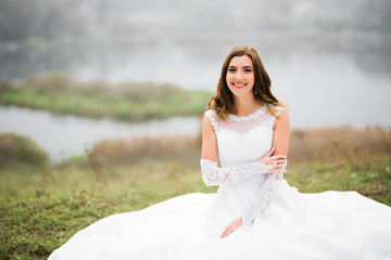 Beautiful fashion bride in wedding dress posing
