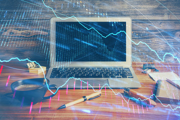 Double exposure of forex graph and work space with computer. Concept of international online trading.