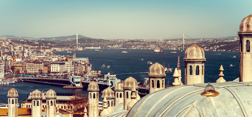 Panorama of Istanbul with Galata bridge at skyline and domes the Suleymaniye Mosque.
