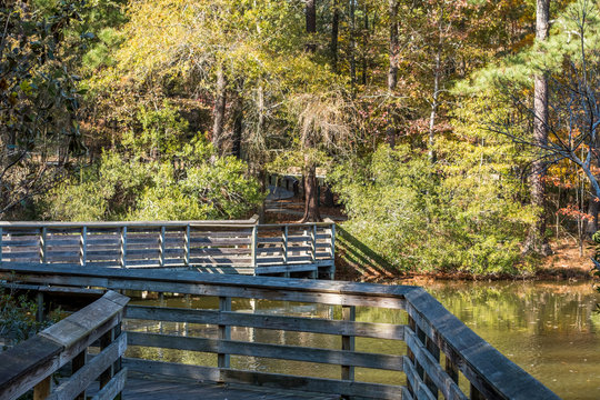A scenic view of the wood footbridge at Crowder Park in Apex, North Carolina.