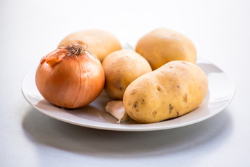 onion potatoes and carrots close up root vegetable