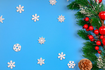 Christmas background. New Year's lights. Spruce branch. Snow. Top view. Close-up.