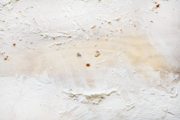 Cutting wooden Board with crumbs from baking and  flour. Top view. Copy space.
