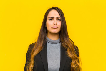young pretty woman feeling sad and stressed, upset because of a bad surprise, with a negative,...