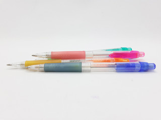 Hand Holding Colorful Artistic Pens for Coloring and Drawing Tools in White Isolated Background