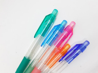 Hand Holding Colorful Artistic Pens for Coloring and Drawing Tools in White Isolated Background