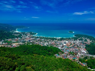 Fototapeta premium Drone panorama Aerial Views of Big Buddha Phuket Thailand kata and karon beach in background turquoise waters 