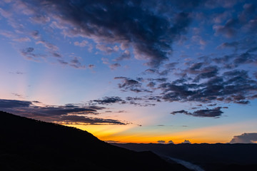 The sun going down behind the mountain