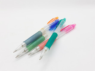 Hand Holding Colorful Artistic Pens for Coloring and Drawing Tools in White Isolated Background