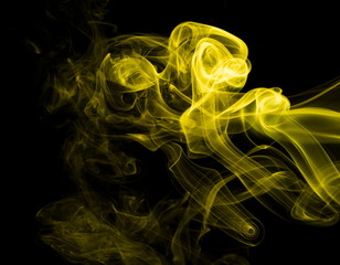 Yellow smoke on black background