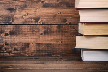 Law books on the brown walnut wooden background.