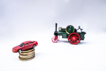 Toy cars with gold coins show To growth, saving money for car loans
