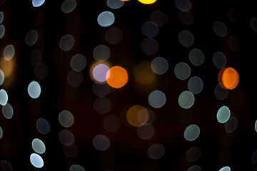Fabulous bokeh of moderate gray circles combined with orange. Abstract festive background for banner.