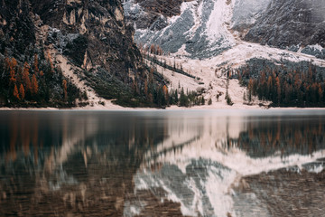 Dolomites Reflection in water in Lago di Braies (Braies lake, Pragser wildsee) South Tyrol, Italy