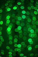 Beautiful festive colored bokeh of glowing circles of different colors. Abstract festive background for banner.